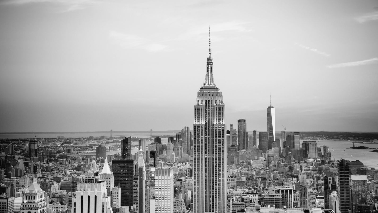 The New York City skyline at dusk, rendered in black and white